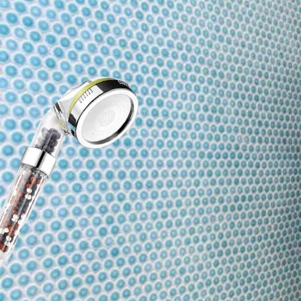 A filtered shower head inside the bathroom