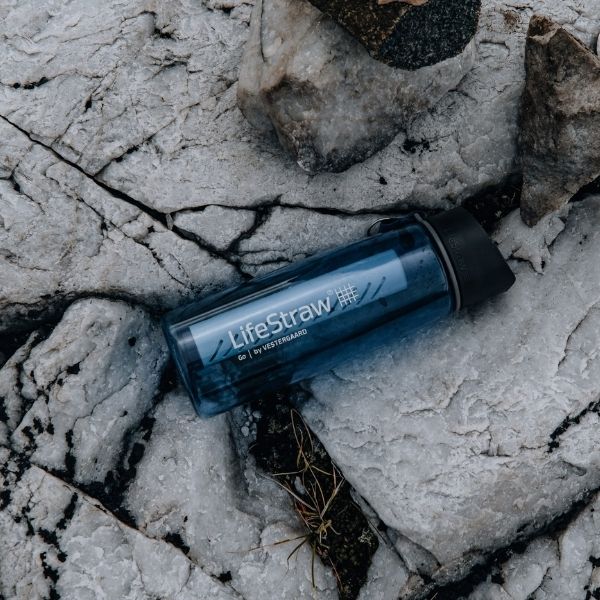 backpacking water filter on rocks