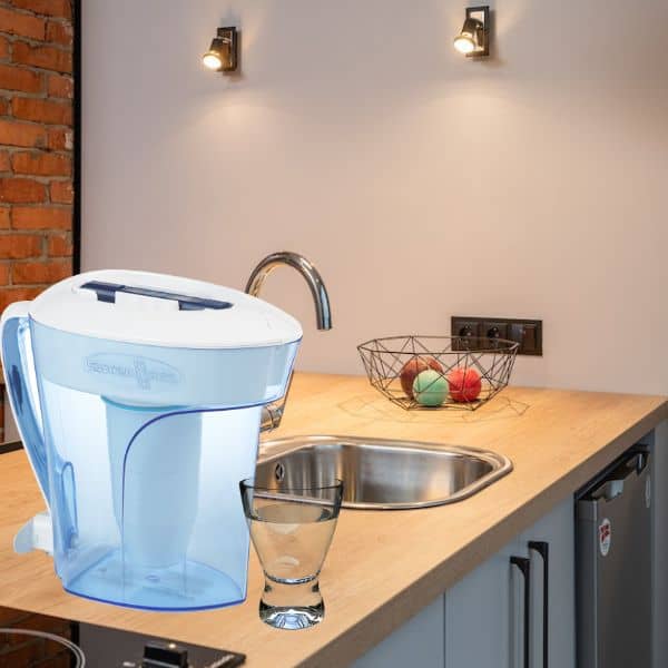 water filter pitcher and a glass of water in the kitchen