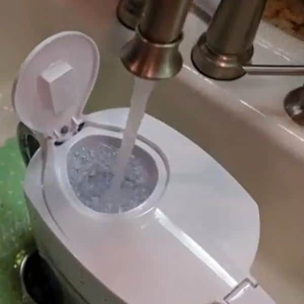 filling brita water filter pitcher with water