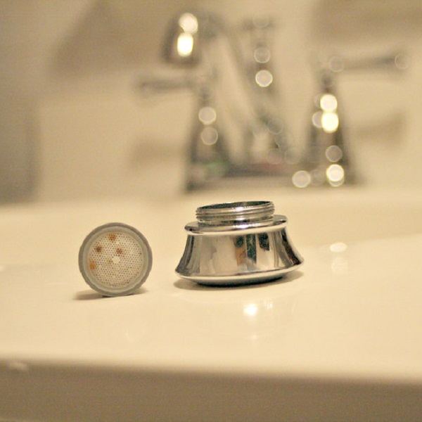 Faucet aerator and end cap for a sink
